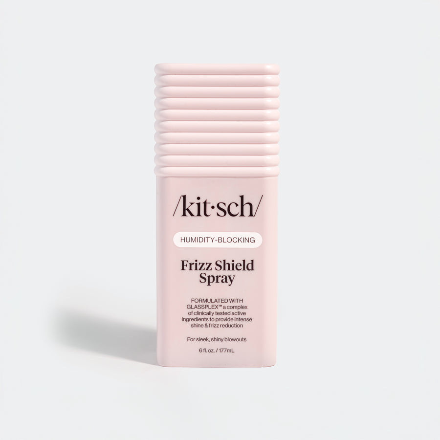 KITSCH Humidity Blocking Frizz Shield Spray — hero standalone bottle shot on light gray background — Humidity-Blocking | Frizz Shield Spray — Formulated with GLASSPLEX™ — For sleek, shiny blowouts — 6 fl. oz. / 177mL — Locks out moisture and prevents frizz, adds intense shine & smooth glass-like finish