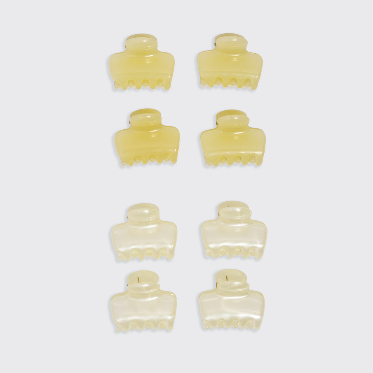 KITSCH Pearlized Cream & Butter Yellow Jelly Cloud Clips Mini — flat lay grid showing all 8 clips in 4 rows of 2 on white background — butter yellow clips top half, pearlized cream clips bottom half — All-Day Hold | 8pcs, Made from Recycled Materials — mini jelly claw clip color comparison shot
