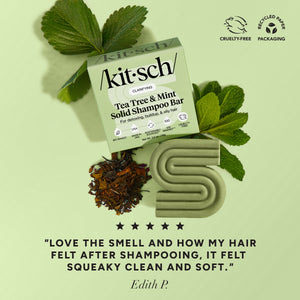 5-star customer review flat-lay for KITSCH Tea Tree & Mint Clarifying Solid Shampoo Bar on light green background styled with fresh mint leaves and tea leaves — Edith P.: "LOVE THE SMELL AND HOW MY HAIR FELT AFTER SHAMPOOING, IT FELT SQUEAKY CLEAN AND SOFT." — Cruelty-Free, Recyclable Paper Packaging