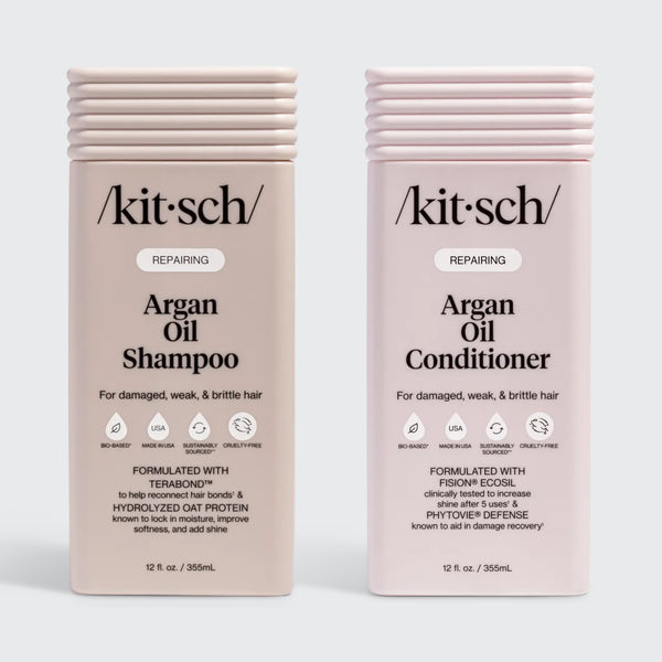 KITSCH Repairing Argan Oil Shampoo 12 fl. oz. & Conditioner 12 fl. oz. Combo — both labeled REPAIRING, For damaged, weak, & brittle hair — icons: Bio-Based, Nontoxic, Sustainably Sourced, Cruelty-Free — Shampoo formulated with Terabond™ & Hydrolyzed Oat Protein; Conditioner formulated with Fision® EcoSil & PhytoVie® Defense