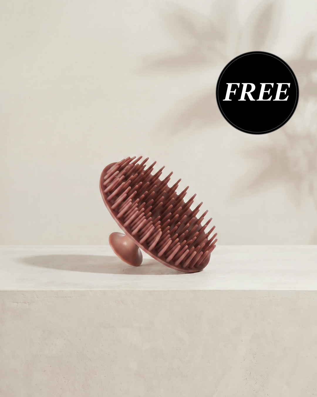 Kitsch Terracotta Scalp Exfoliator shown from two angles displaying the soft silicone bristles for scalp massage and gentle exfoliation